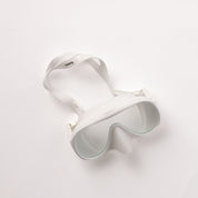 The Honey Swim Honey Goggles have a sleek white design and adjustable strap, providing a leak-proof fit for panoramic snorkeling adventures.