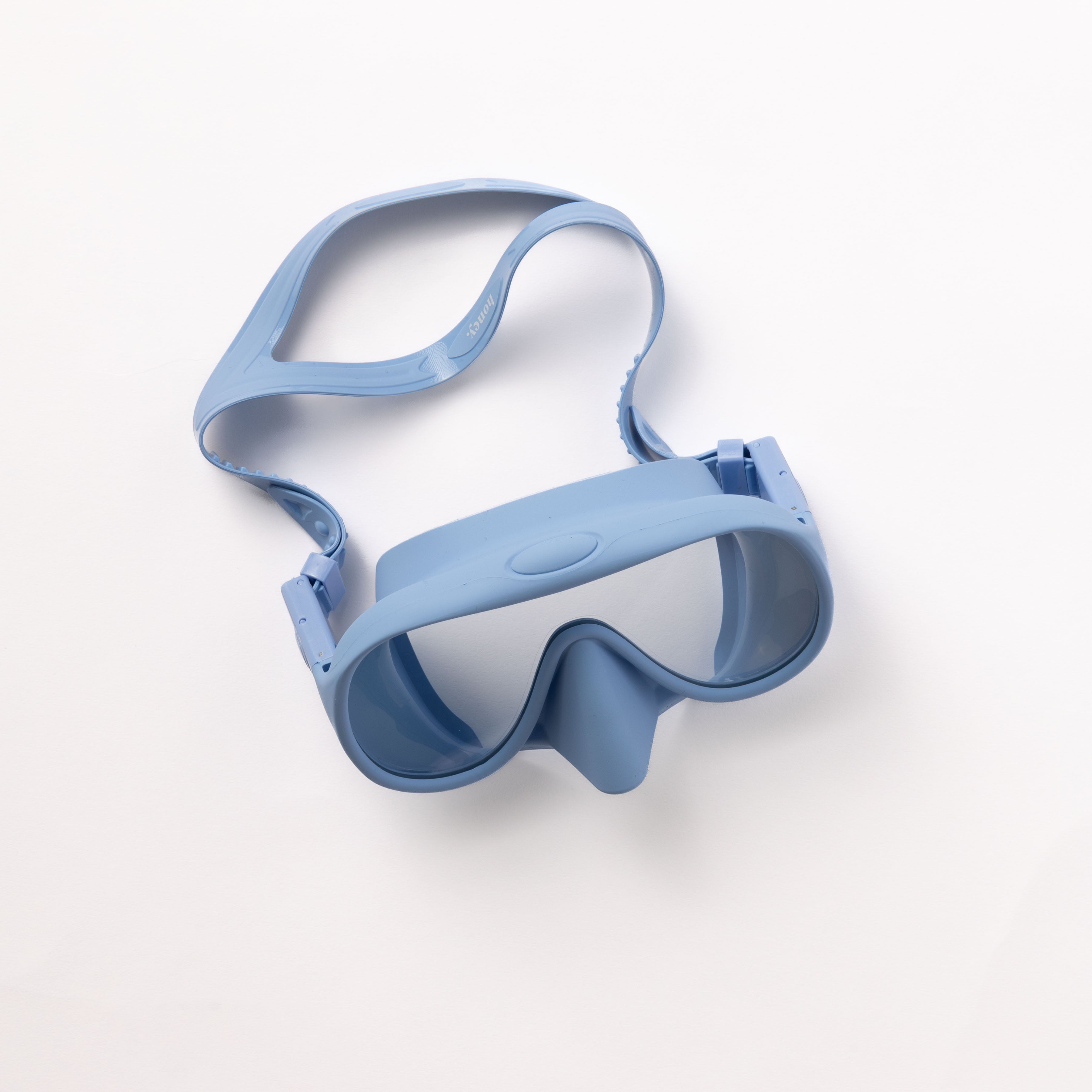 The Honey Goggles from Honey Swim are summery blue diving goggles with a clear lens and adjustable strap, designed for a leak-proof fit, set against a plain white background.